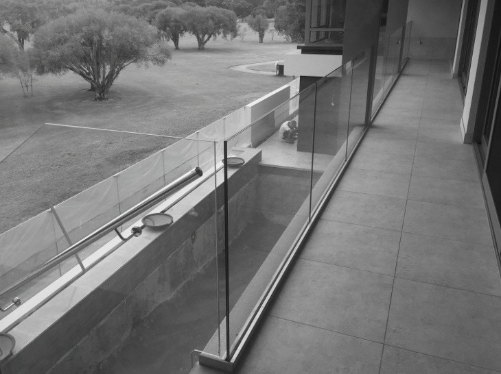 Metforce Channel frameless glass balustrade with aluminium base shoe and stainless steel handrail, Perth