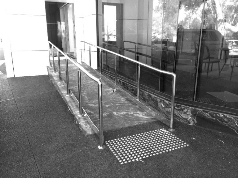 Metforce stainless steel floor mounted handrail with round posts and kick rail, Perth