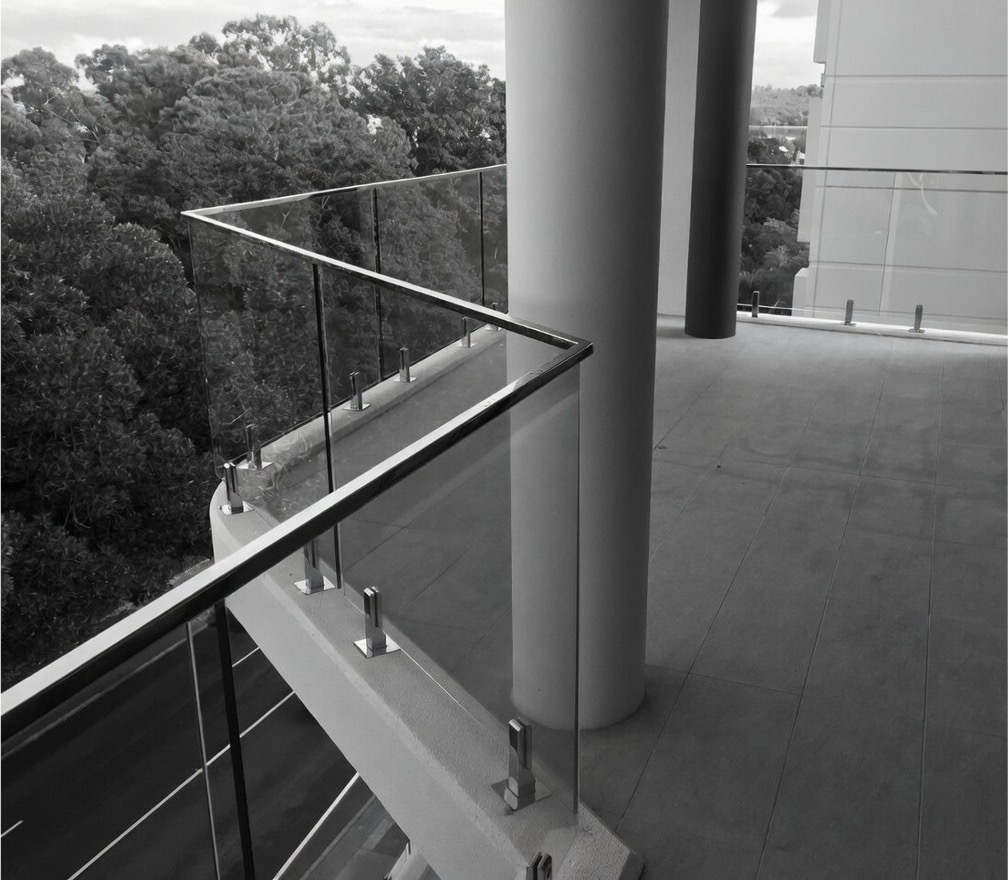 Metforce Spigot stainless steel and glass balustrade with round spigots and top mounted handrail, Perth